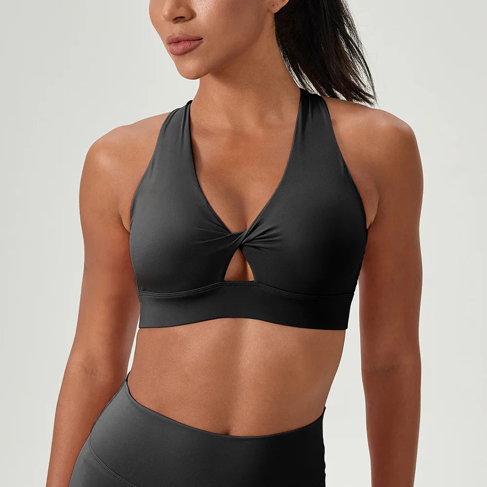 Alate Impact Women's Black Halterneck Sports Bra  featuring a  cross back and front twist detail . 